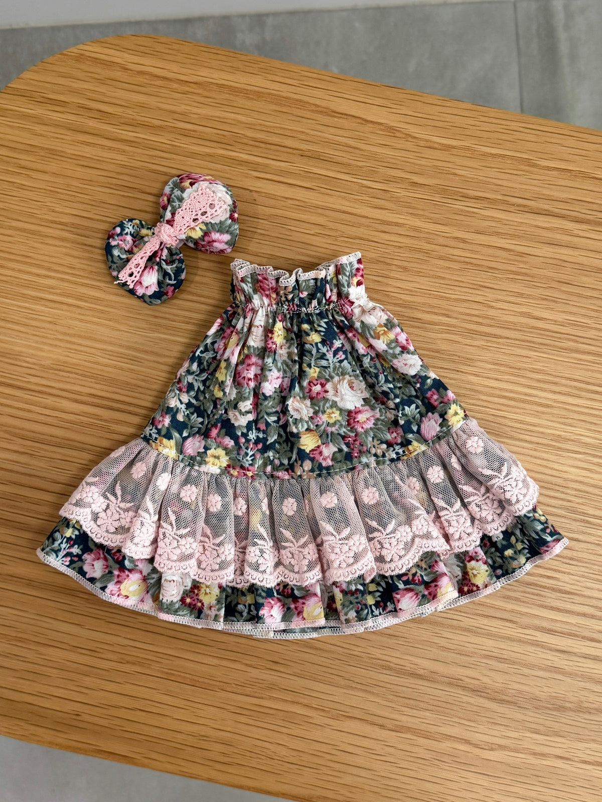 Vintage floral tiered dress for a plush bunny with pink embroidered lace and matching bow hair clip
