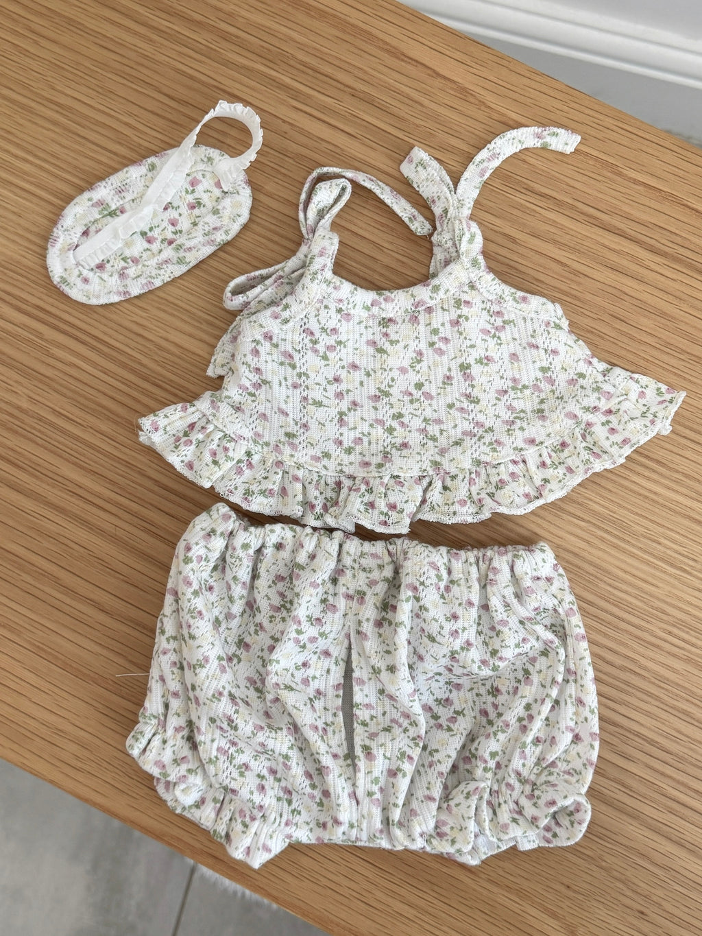 Back view of pink floral cami top and bloomer shorts with matching sleep mask for a plush bunny
