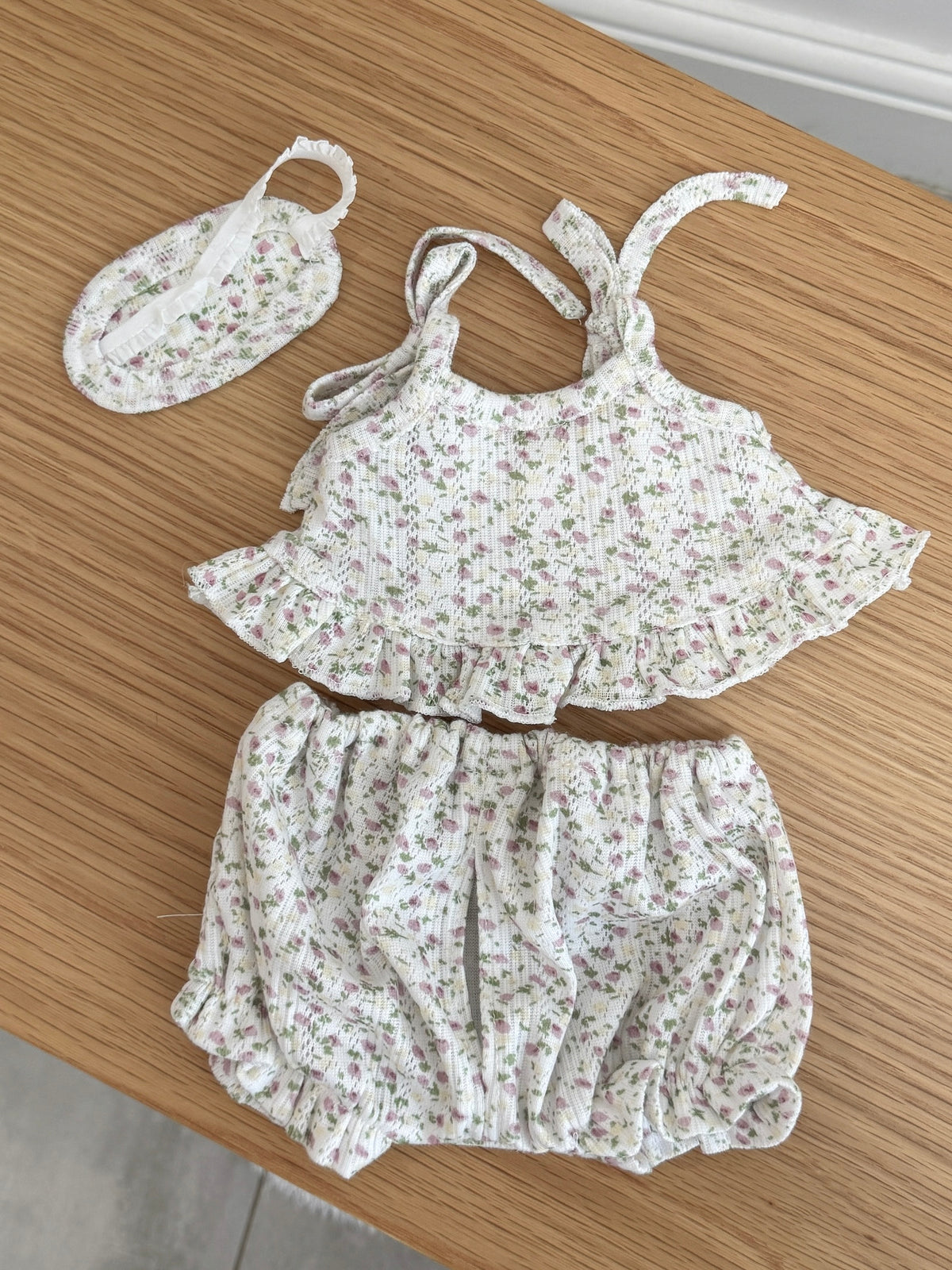 Back view of pink floral cami top and bloomer shorts with matching sleep mask for a plush bunny