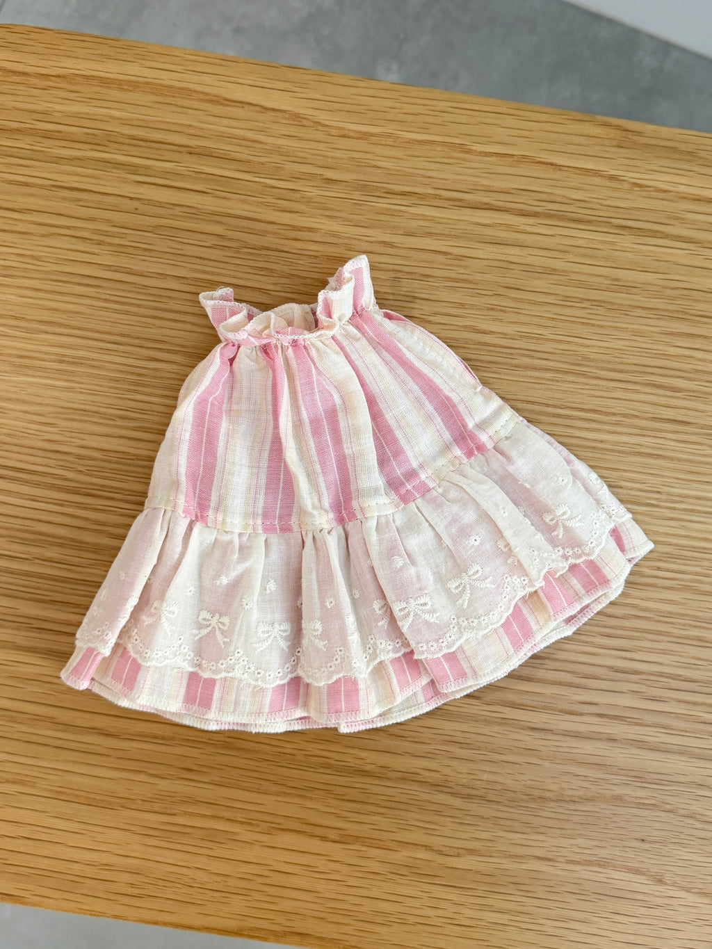 Pink and cream striped plush bunny dress with layered ivory embroidered lace