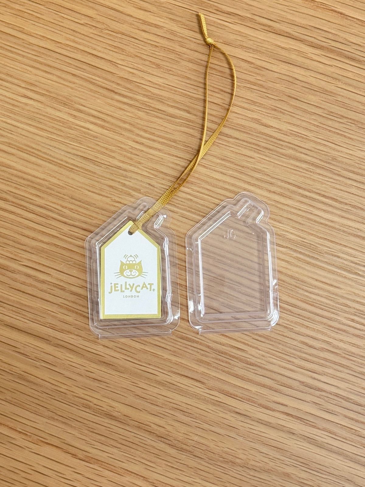 Small clear tag protector shown fitted around a Jellycat swing tag