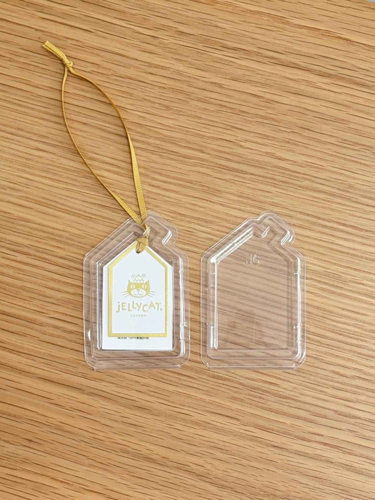 Large clear tag protector shown fitted around a Jellycat swing tag